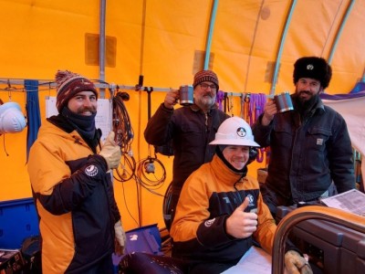 Ollie Twigge, Darcy Mandeno, James McPhail and Tim McPhee celebrate breaking through the Ross Ice Shelf and into the ocean below