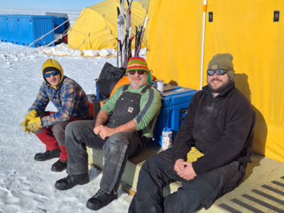 Alex Michaud, Gavin Dunbar and Jason Coenen outside the mess tent