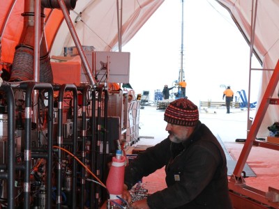 Darcy Mandeno checking the hot water system in the drill tent