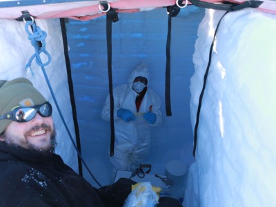 Jason Coenen and Alex Michaud sampling snow in the cellar pit